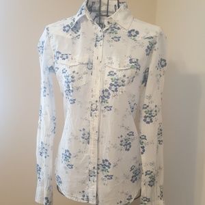 Blue and white flowered cowgirl shirt.